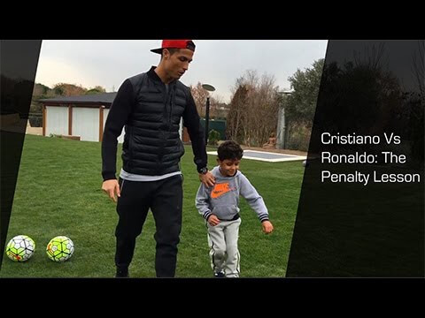 Cristiano Ronald playing soccer with child
